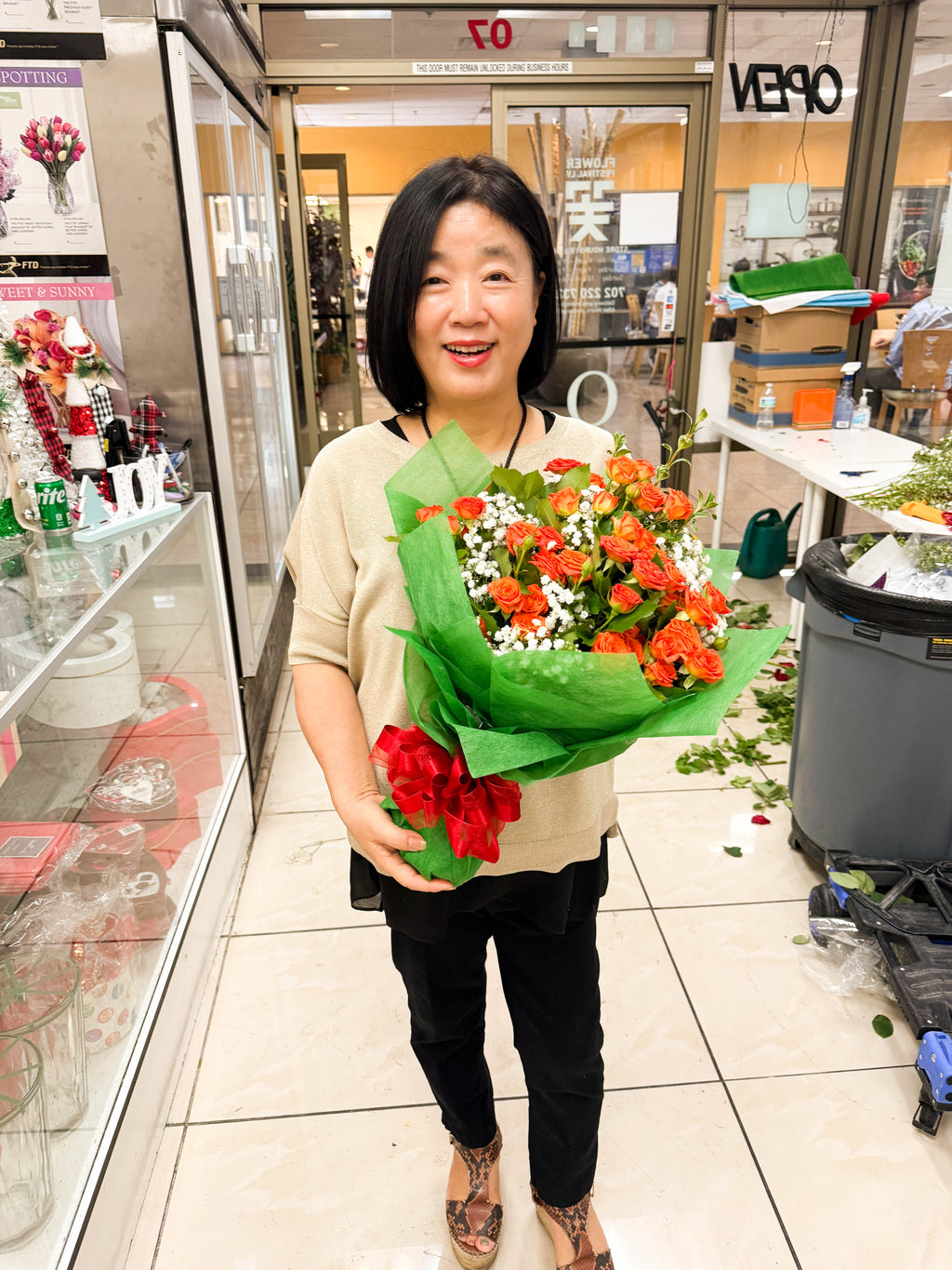 Miss Kim Mikyung Kim with Celebration Baby Rose Wrapping Green